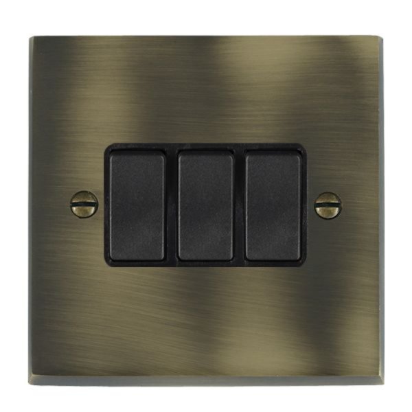 Hamilton 93R23BL-B Cheriton Victorian Antique Brass 3 Gang 10AX 2 Way Switch with Black Rockers and Black Surround