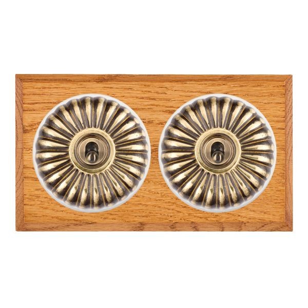 Hamilton Bloomsbury Chamfered Medium Oak 2 Gang 20AX Intermediate Toggle Switch with Antique Brass Fluted Dome and White Collar