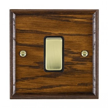 Hamilton Woods Ovolo Dark Oak 1 Gang 10AX 2 Way Switch with Polished Brass Rocker and Black Surround