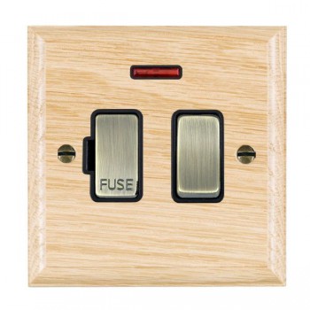 Hamilton Woods Ovolo Light Oak 13A Double Pole Switched Fused Spur and Neon with Antique Brass Insert and Black Surround
