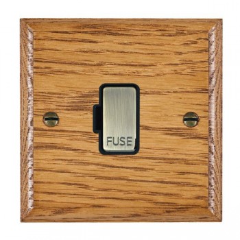 Hamilton Woods Ovolo Medium Oak 13A Unswitched Fused Spur with Antique Brass Insert and Black Surround