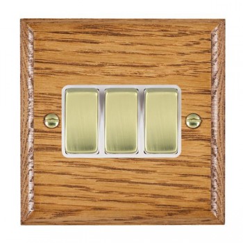Hamilton Woods Ovolo Medium Oak 3 Gang 10AX 2 Way Switch with Polished Brass Rockers and White Surround