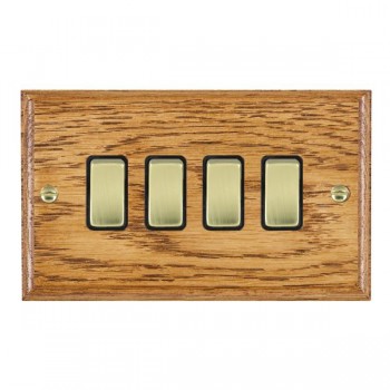 Hamilton Woods Ovolo Medium Oak 4 Gang 10AX 2 Way Switch with Polished Brass Rockers and Black Surround