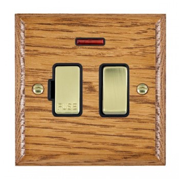 Hamilton Woods Ovolo Medium Oak 13A Double Pole Switched Fused Spur and Neon with Polished Brass Insert and Black Surround